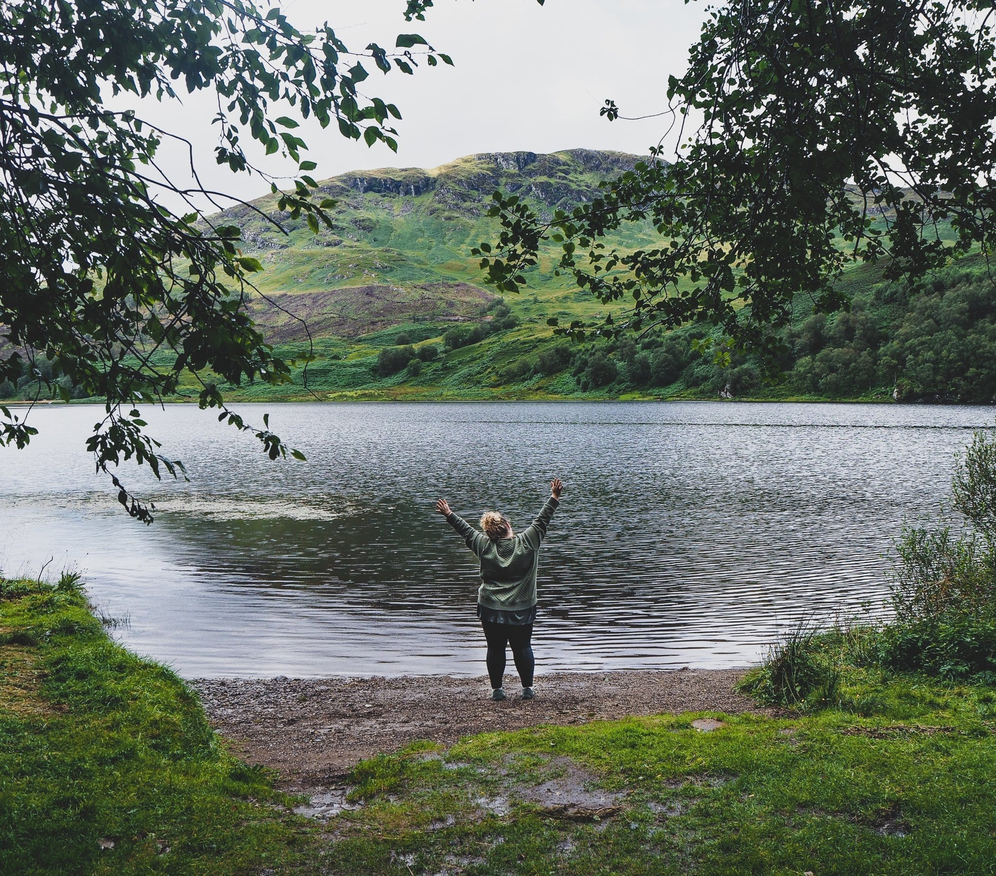 plus size travel -- How to take better photos and improve your self esteem - picture of traveler enjoying the moment